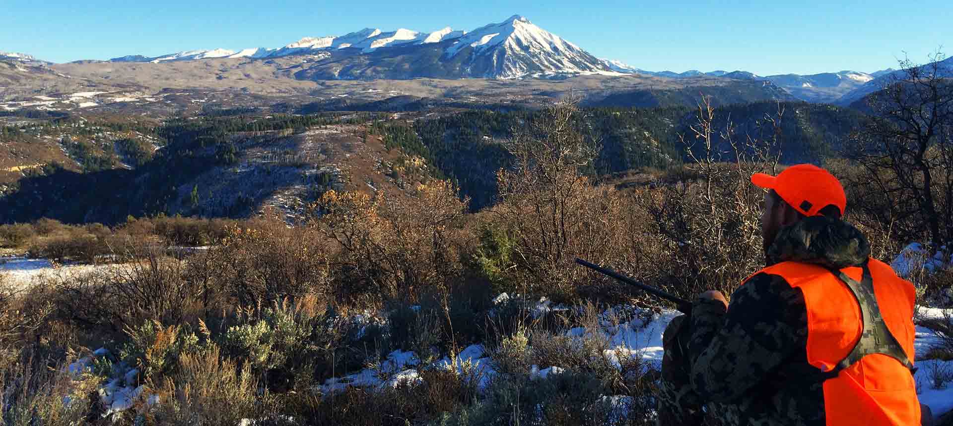 hunter overlooking mountain 