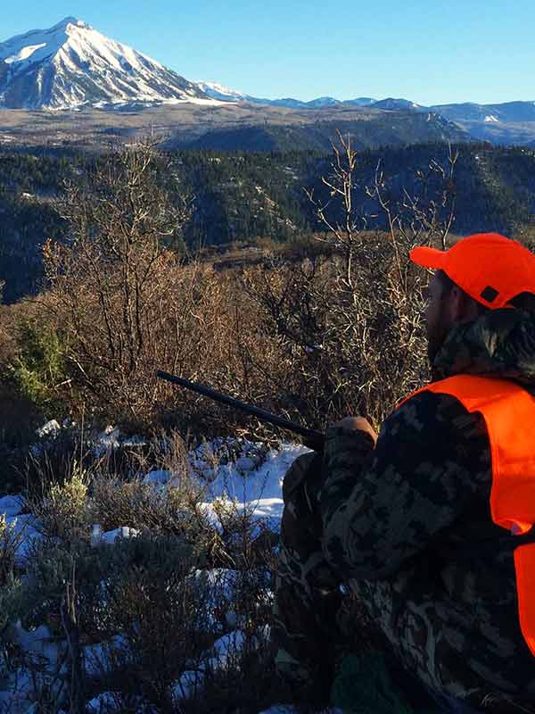 hunter overlooking mountain 