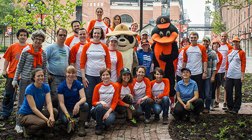 a group of gardeners with Ranger Rick and the Oriole Bird mascot